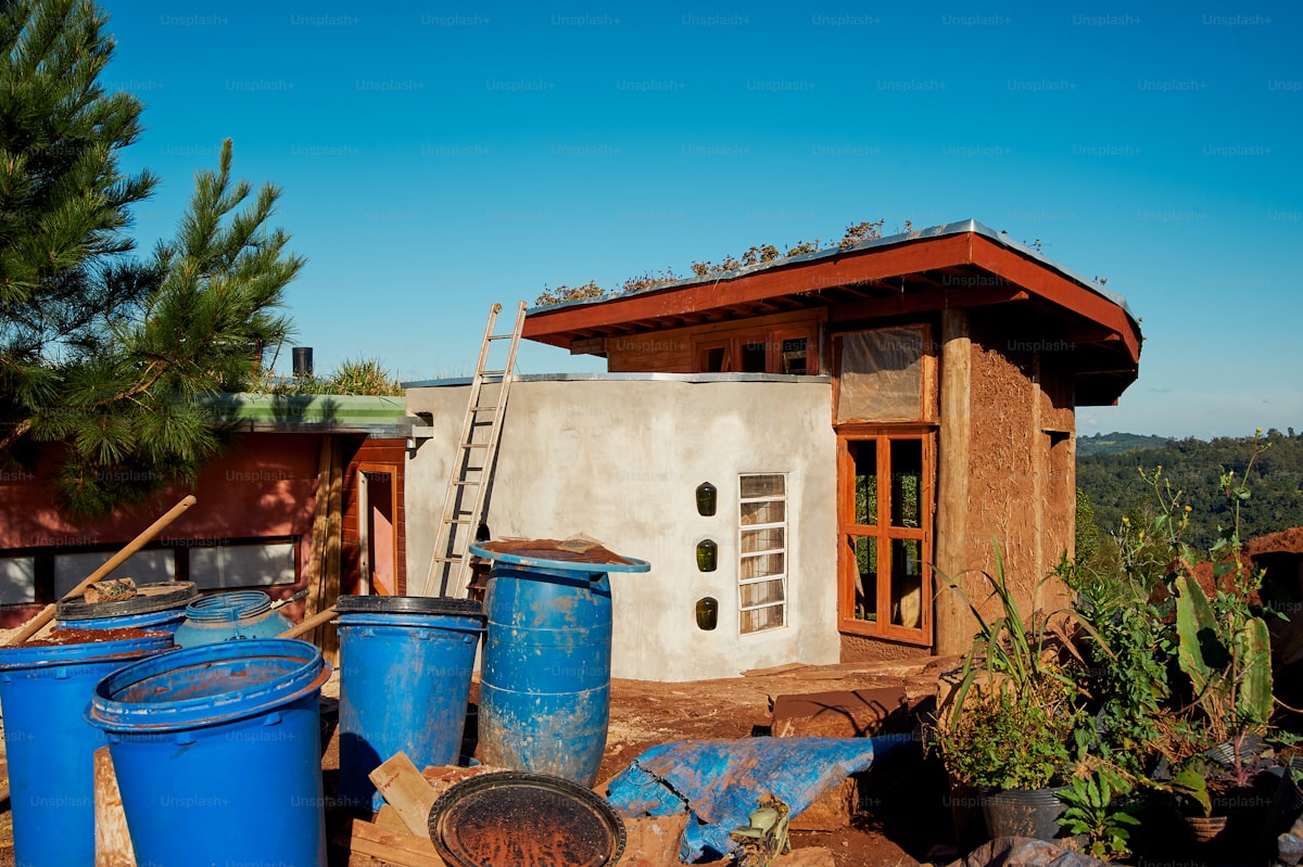 Adobe house under construction with traditional building methods