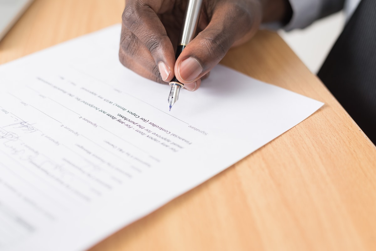 Person reviewing property documents at a desk