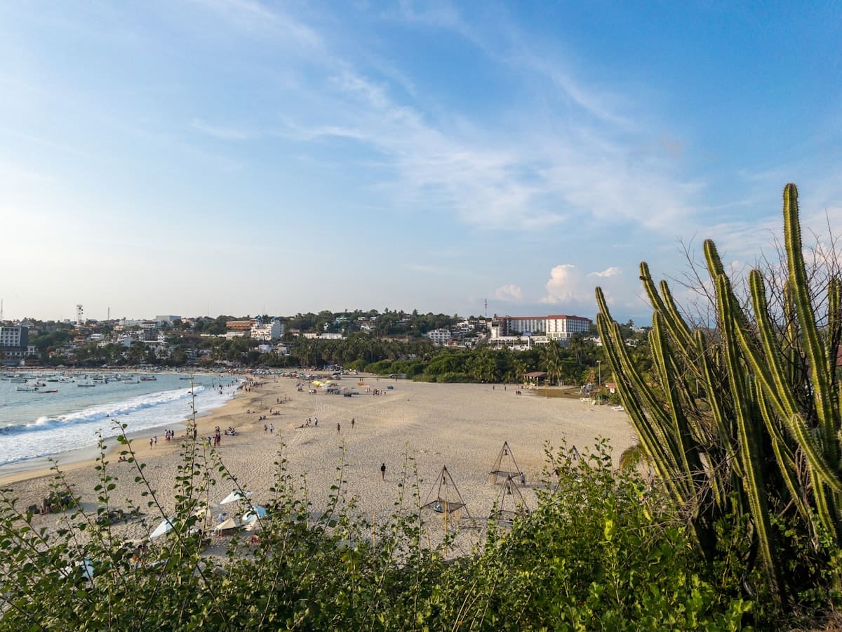 Beachgoers enjoying a sunny day on the Pacific coast