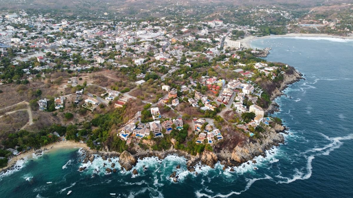 Aerial view of a small island surrounded by turquoise water