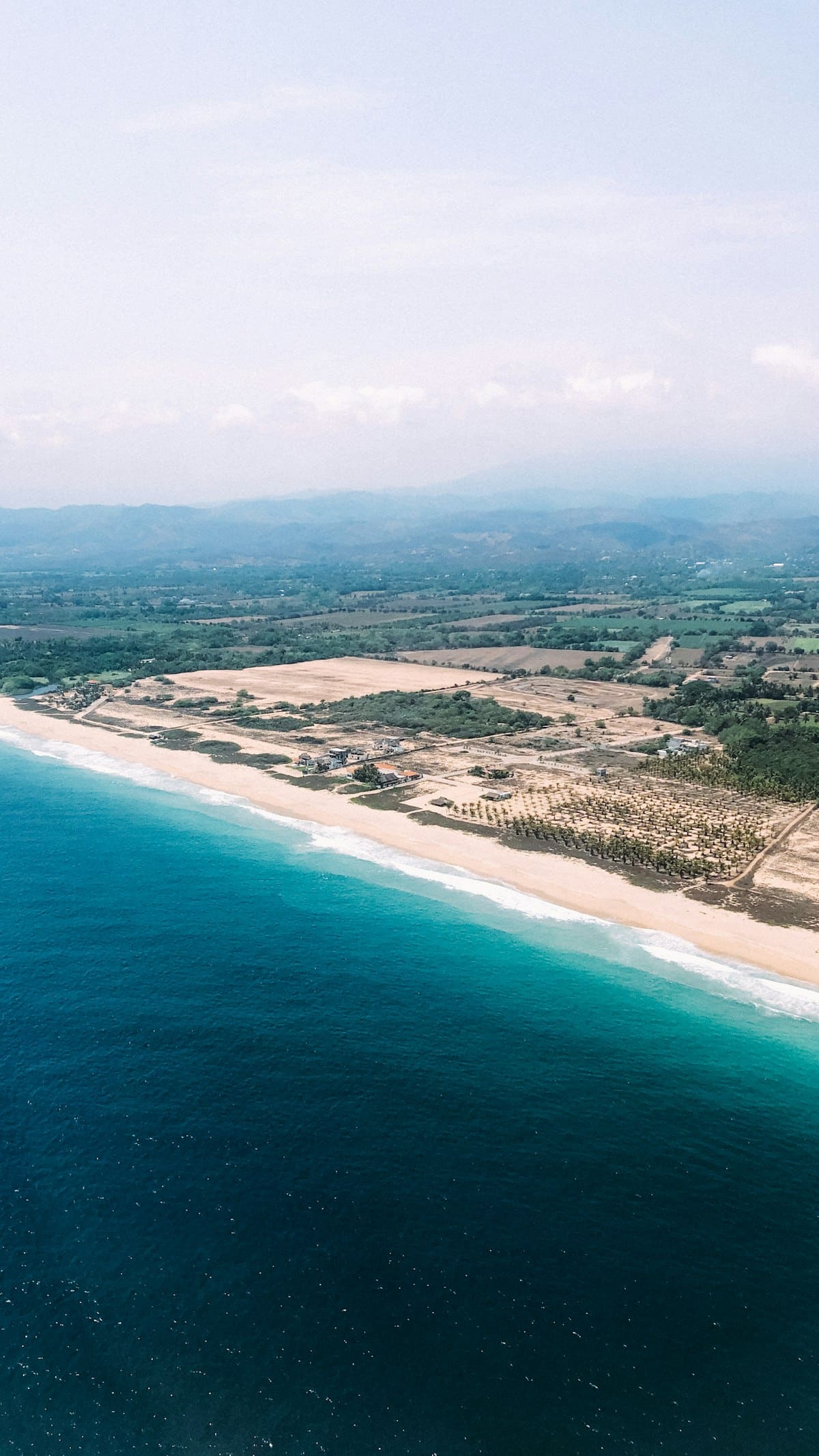 Aerial view of beach and lagoon meeting point