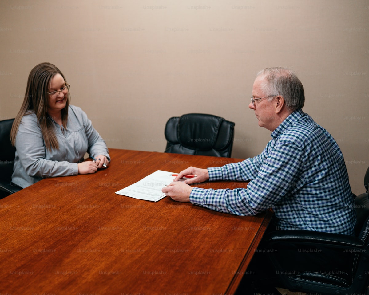 Couple reviewing property financials at a table