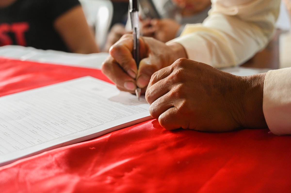 Person reviewing financial documents and calculations